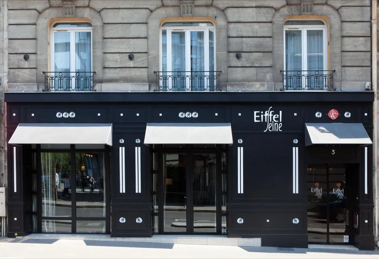 The Eiffel Seine hotel entrance is shown in a historic Parisian building facade.